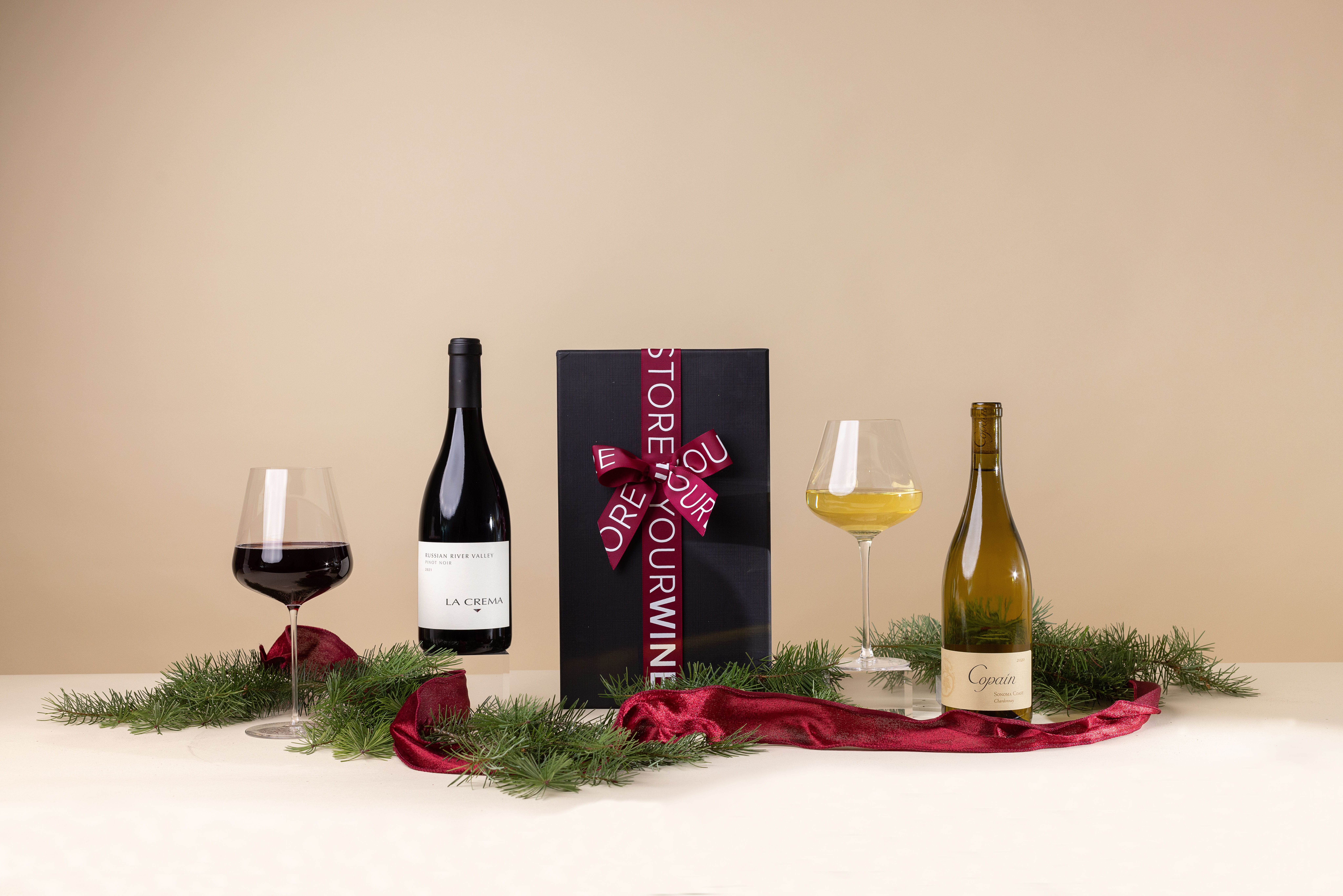Friends gifting wines to each other.